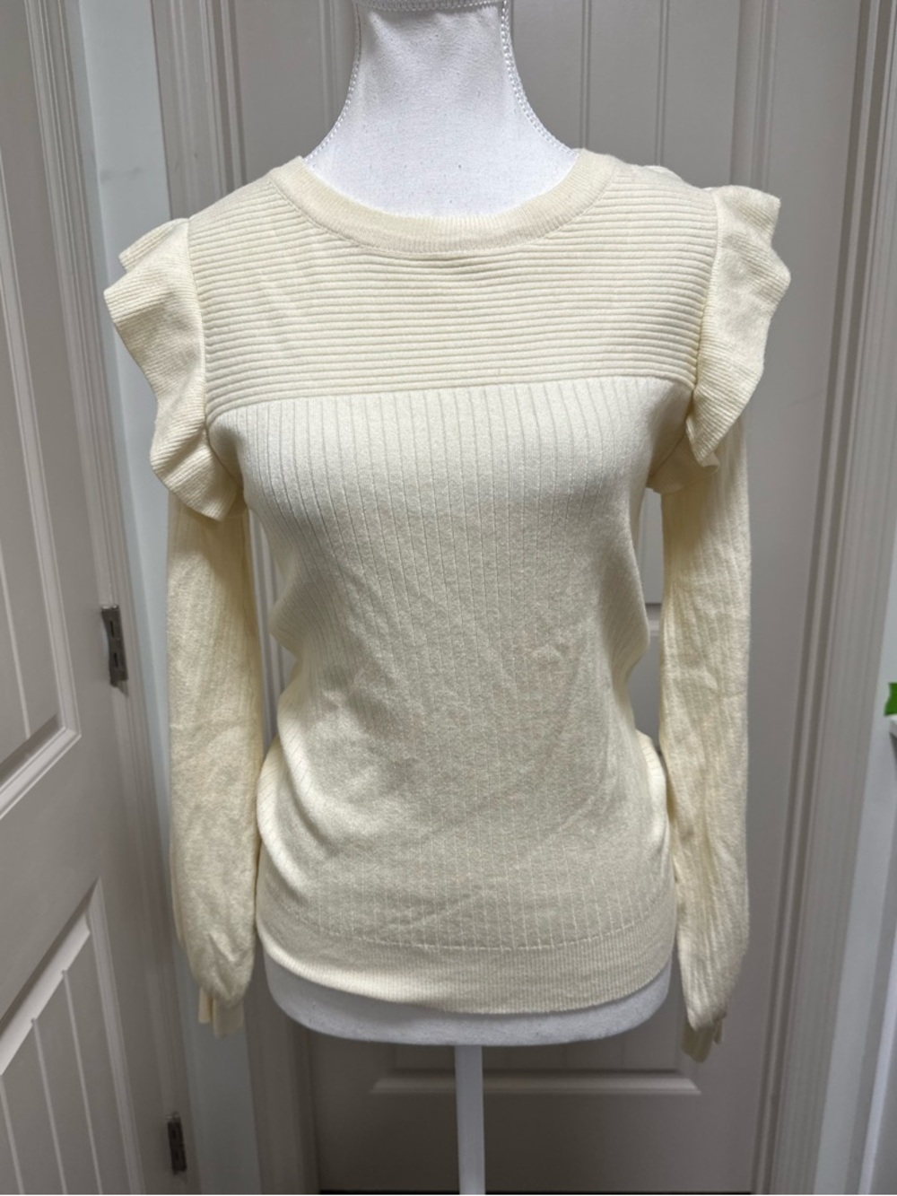 vestique Ivory Ribbed Knit Top with Subtle Ruffle Shoulder